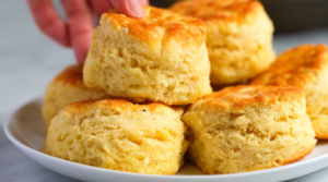 Soft biscuit dough ready for baking, showcasing its sticky texture.