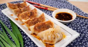 A platter with steamed, boiled, and pan-fried dumplings.