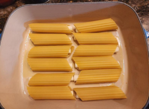 Fresh uncooked manicotti in airtight packaging.