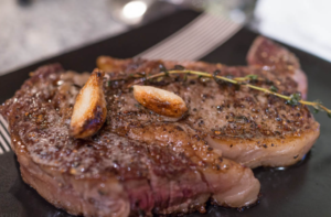 Perfectly cooked ribeye steak with a golden crust